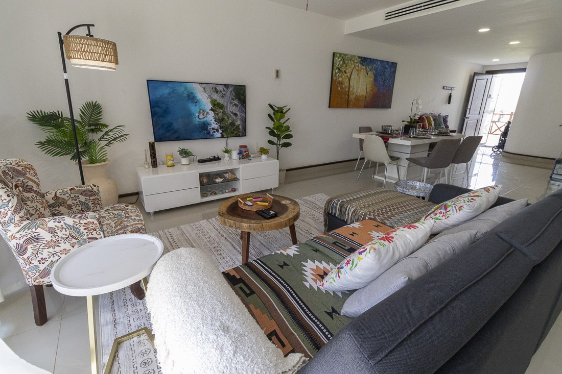 Living room seating area at Avalon del Sol opening to the balcony